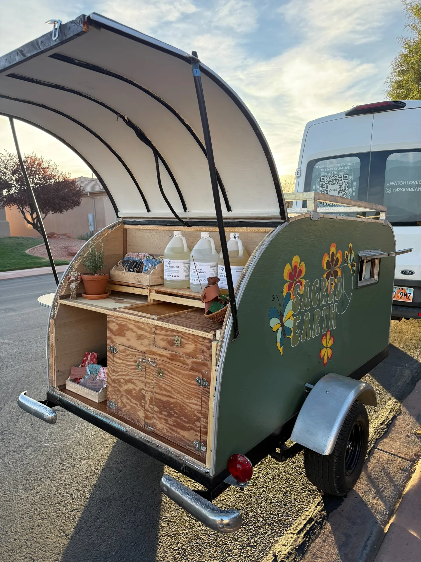 Gwen — the Sacred Earth mobile refillery trailer, open and stocked with zero-waste goods